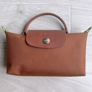 Longchamp Le Pliage green pouch with handle in cognac